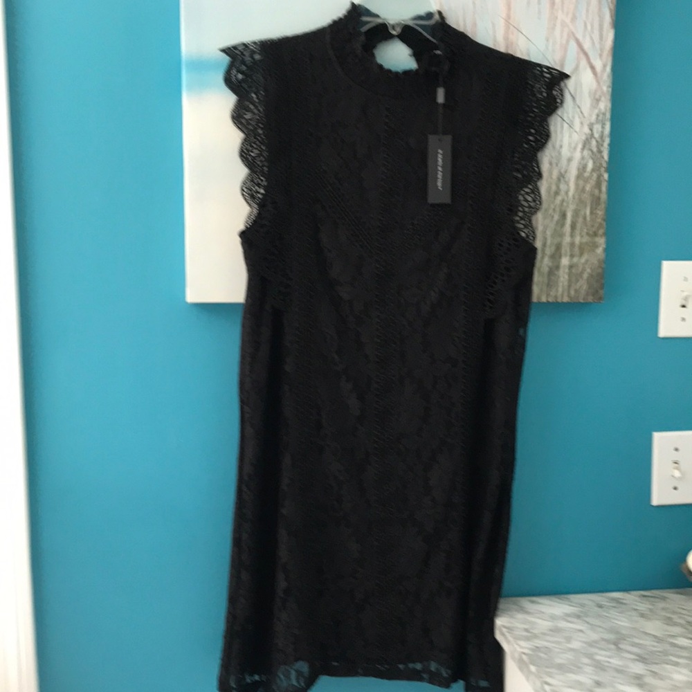 Absolutely gorgeous black lace dress fully lined never been worn.